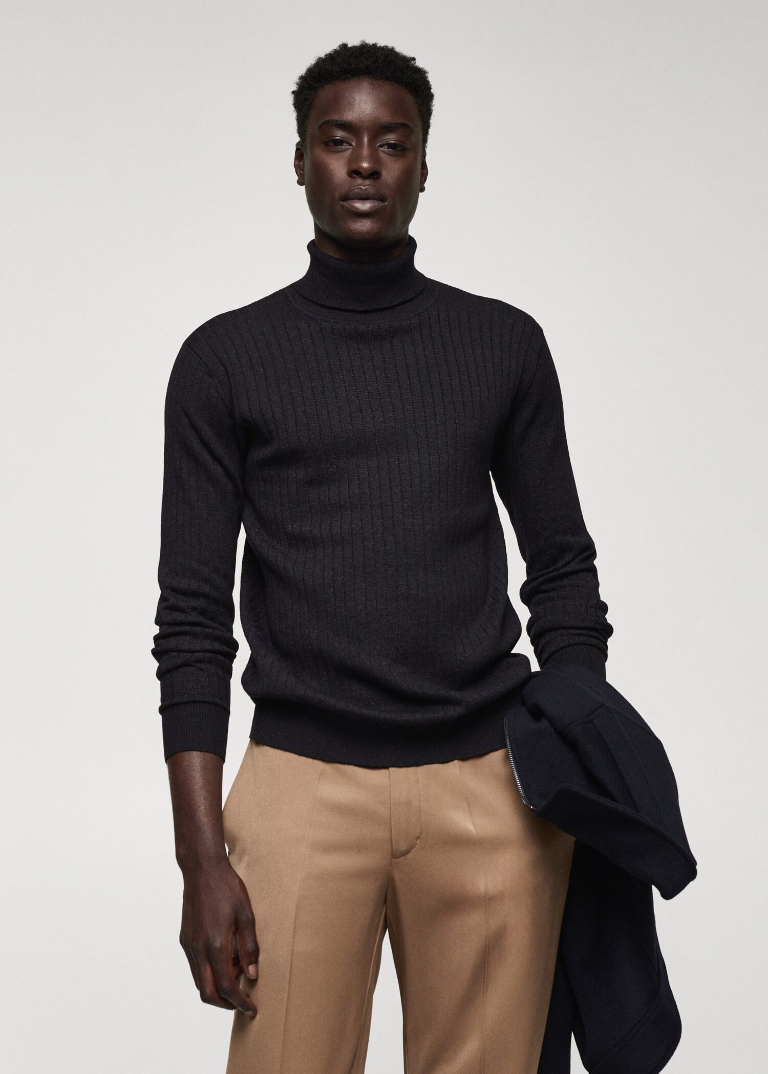 Rolled neck cable sweater