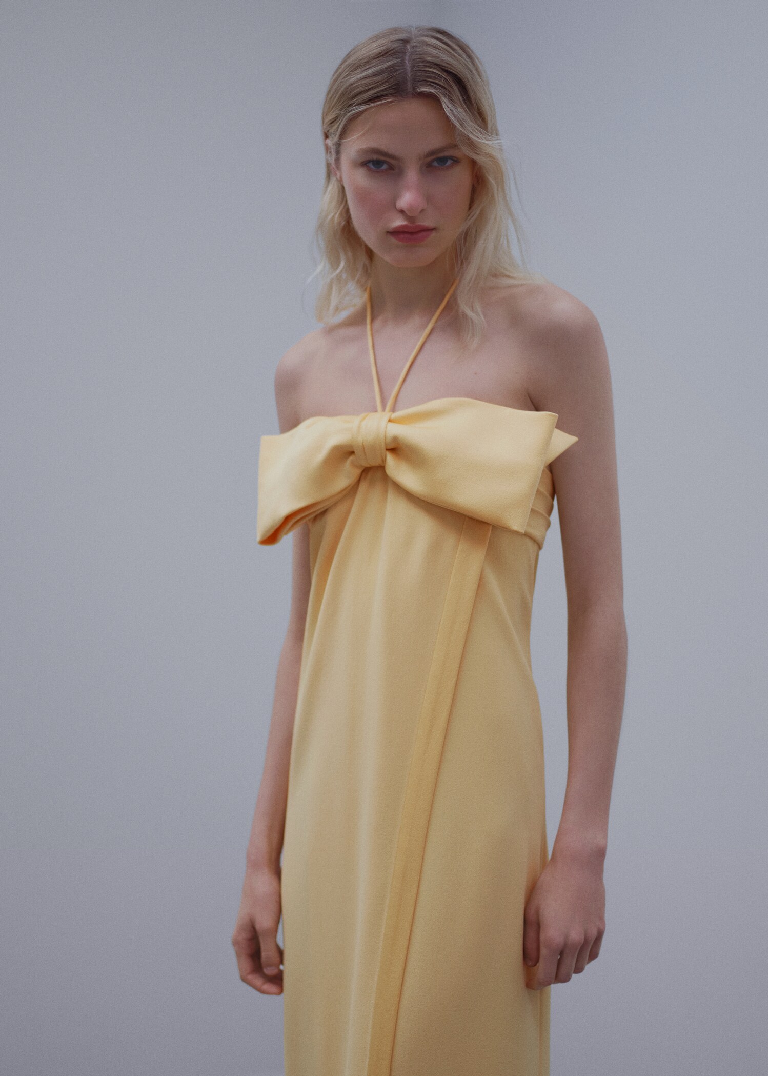 Crossed dress with bow neckline
