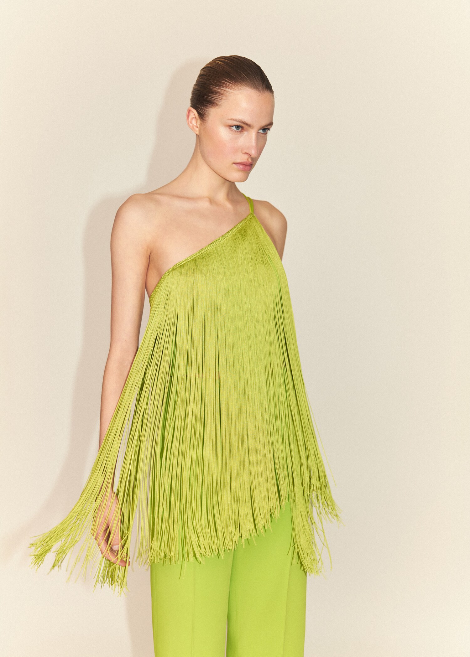 Asymmetrical fringed top