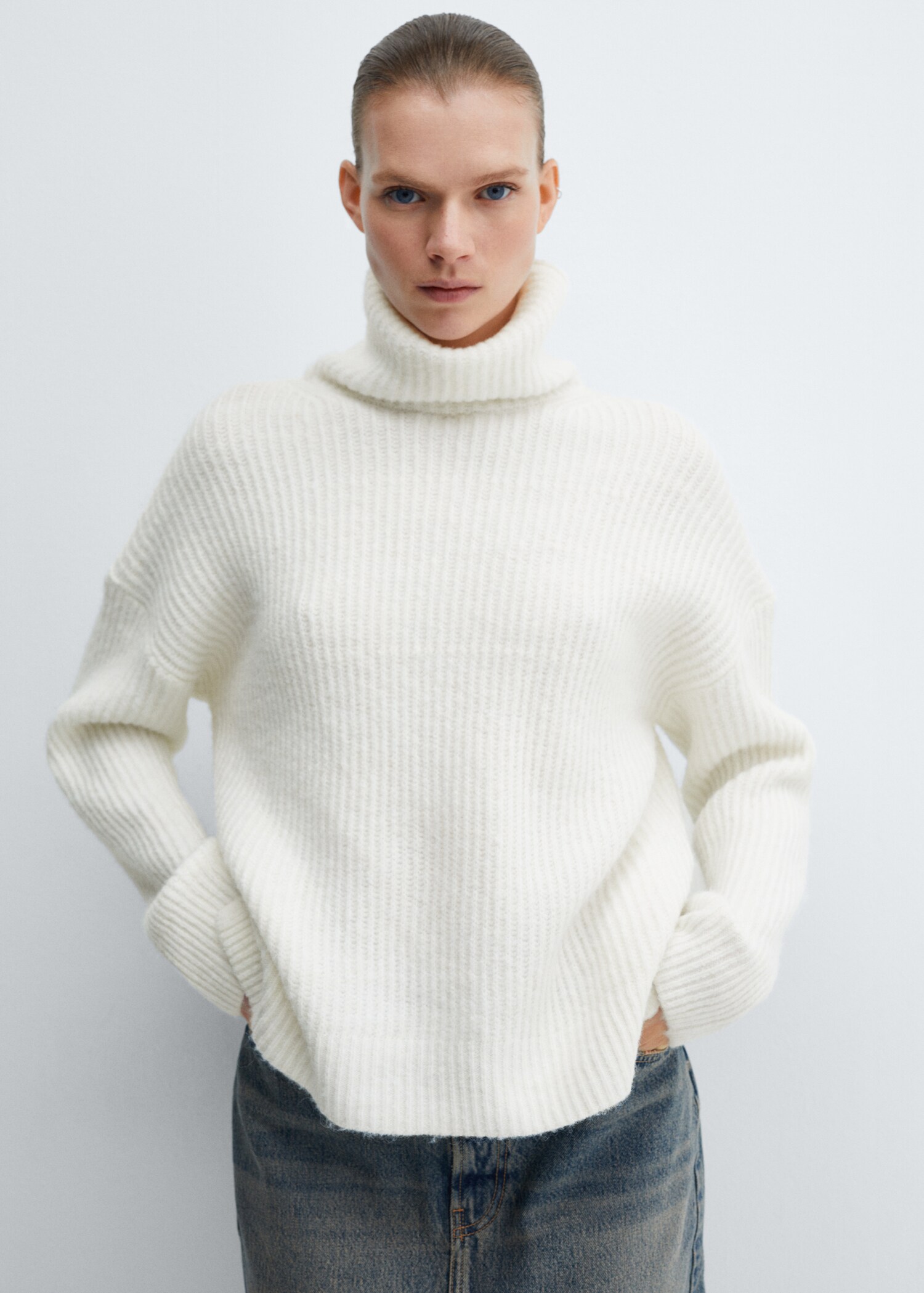 Rolled neck cable sweater