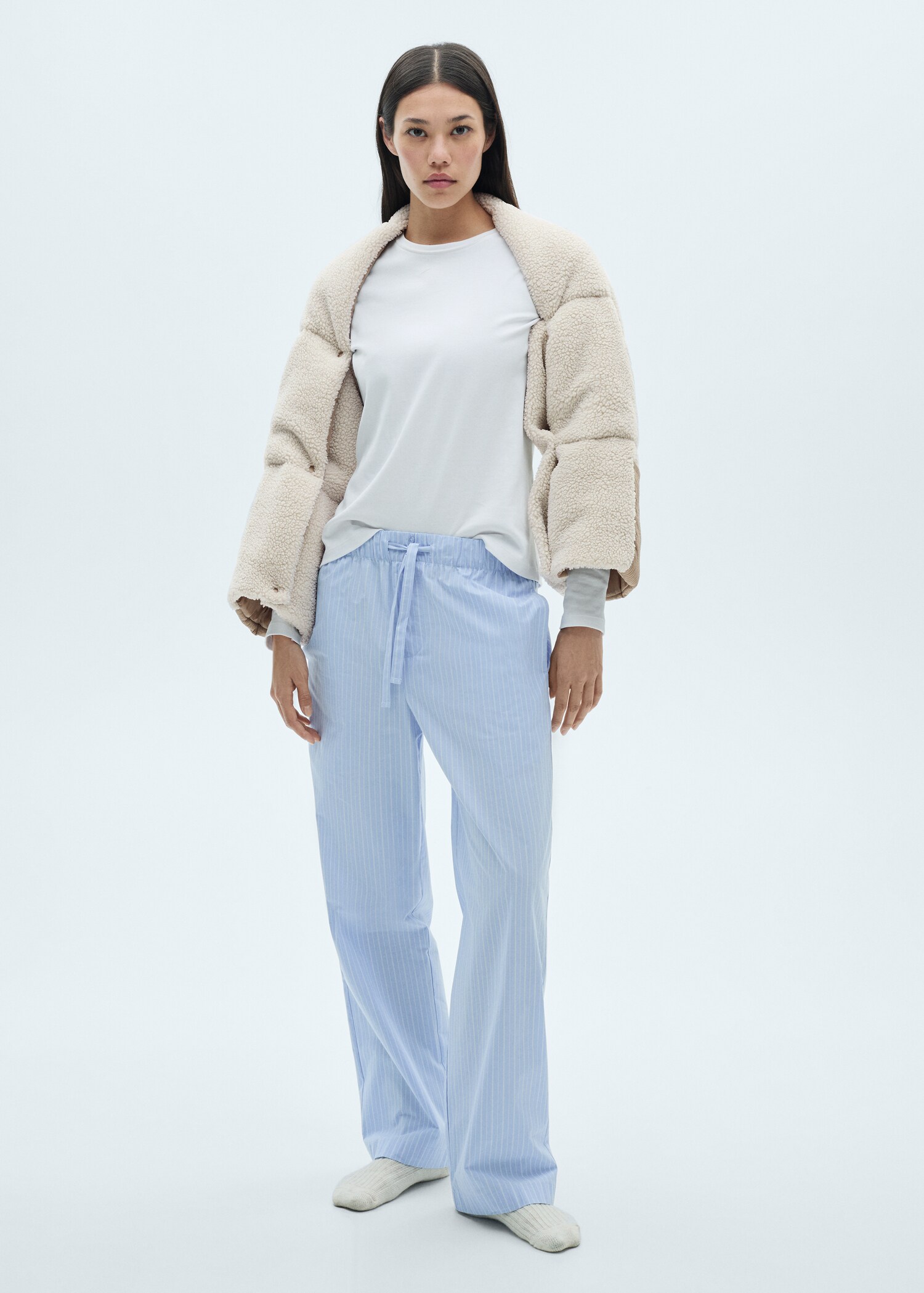 Buttoned sheepskin cape